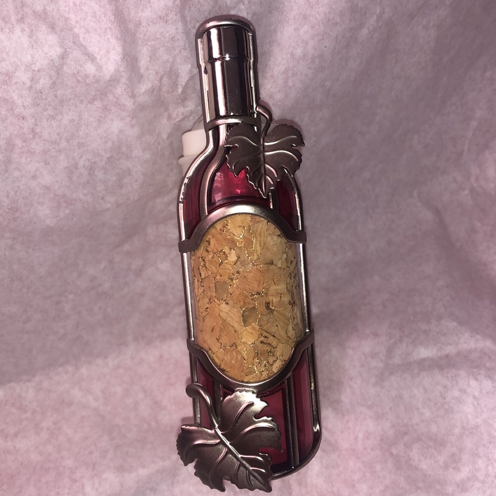 Bath & Body Works Wine Bottle with etched metal leaves accent. Gold infused cork